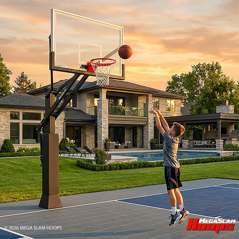A MegaSlam 72 in-ground hoop on a finished modular tile court, with a player shooting
